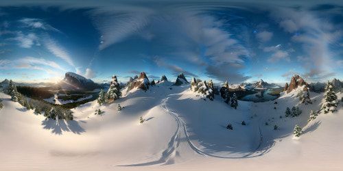 Mountain peak frost, sparkling pristine snow in ultra-realistic quality, jagged terrain against clear, icy blue sky, VR360 view. Breathtaking sunlight glint, long shadows, enhanced in masterful, high-resolution digital painting style, VR360 finesse.