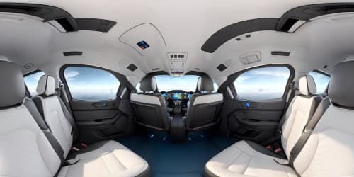 seated in an airliner in economy class with backseat tv