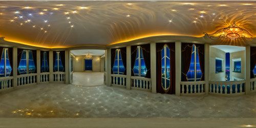A flawlessly designed, opulent skyscraper penthouse balcony at night, overlooking a shimmering cityscape reflected in the glistening river below, set against a star-studded celestial backdrop, a breathtakingly detailed and ultra-high-resolution tableau fit for an artist's definitive masterpiece.