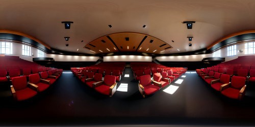 Masterpiece VR360 auditorium, ultra high-res, top-tier quality. Endless rows of vacant chairs, polished wood stages. Eerie spotlight, looming microphone. Overwhelming sense of anticipation. VR360 panorama of the vast, silent crowd space. Strikingly detailed, ultra high-definition. Edgy, photorealistic style. Anxiety-inducing vastness, captured in VR360 elegance.