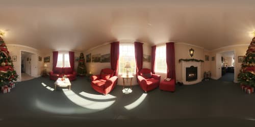 Masterpiece VR360 scene, ultra-high resolution, realistic '70s British Christmas in council house. VR360 view of vintage decorations, authentic presents, soft glow from the Christmas tree.