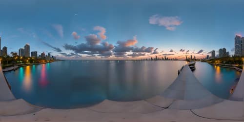 VR360 digital realism, ultra-high resolution, shimmering city lights, Miami Beach florida skyline at night, riverside reflections on water. Overarching darkness, masterpiece quality, VR360 vividness amplified.