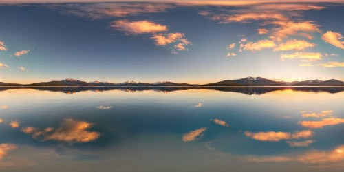 An exquisite, flawless mountain vista at golden hour, reflecting on a glassy lake, soft colors, with a serene tranquility under a pastel sky.