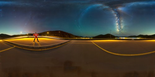 Freakazoid standing in a vast liminal parking lot under a clear night sky.