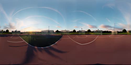 VR360 skybox, fiery sunset, handball court silhouette, grandeur, ultra high res. Clouds mirroring court lines, surreal art style, VR360 view, masterpiece quality.