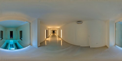 A flawless and expansive subterranean liminal pools adorned with immaculate white minimalist tiling and eerie fluorescent lights, casting an eerie yet captivating ambiance, its dark hallways opening into vast interconnected chambers, elevating this ultra-high-resolution masterpiece to a mesmerizing pinnacle of perfection.